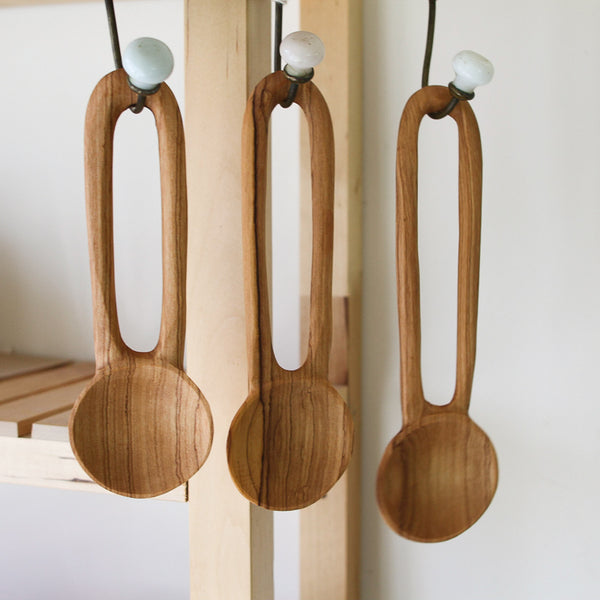 https://www.brookfarmgeneralstore.com/cdn/shop/products/Set-of-3-Olivewood-Hanging-Spoons-3.jpg?v=1652713121&width=600